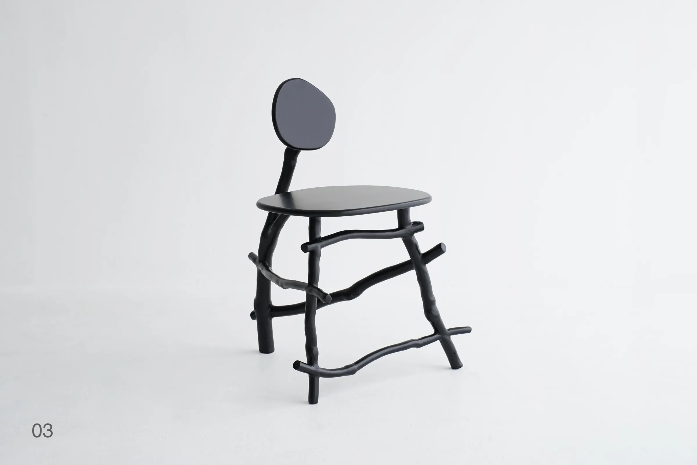 Uneri 03 chair with rounded back showing branch joinery and natural curves contemporary Japanese furniture design